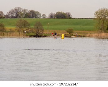 Pickmere Lake, Pickmere, Knutsford, Cheshire, UK. 24th April 2021. Open Water Swimmer Group Taking Part In Organised Open Water Swimming Training, Pickmere, Knutsford, Cheshire, Uk