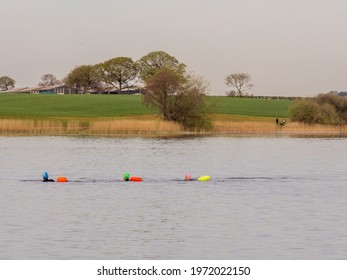 Pickmere Lake, Pickmere, Knutsford, Cheshire, UK. 24th April 2021. Open Water Swimmer Group Taking Part In Organised Open Water Swimming Training, Pickmere, Knutsford, Cheshire, Uk