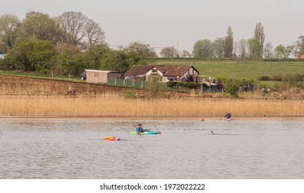 Pickmere Lake, Pickmere, Knutsford, Cheshire, UK. 24th April 2021. Open Water Swimmer Group Taking Part In Organised Open Water Swimming Training, Pickmere, Knutsford, Cheshire, Uk