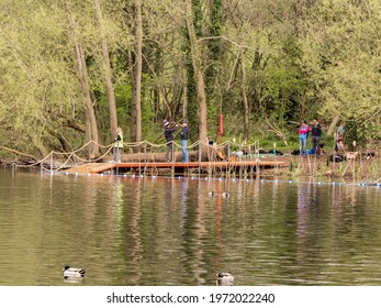 Pickmere Lake, Pickmere, Knutsford, Cheshire, UK. 24th April 2021. Open Water Swimmer Group Taking Part In Organised Open Water Swimming Training, Pickmere, Knutsford, Cheshire, Uk