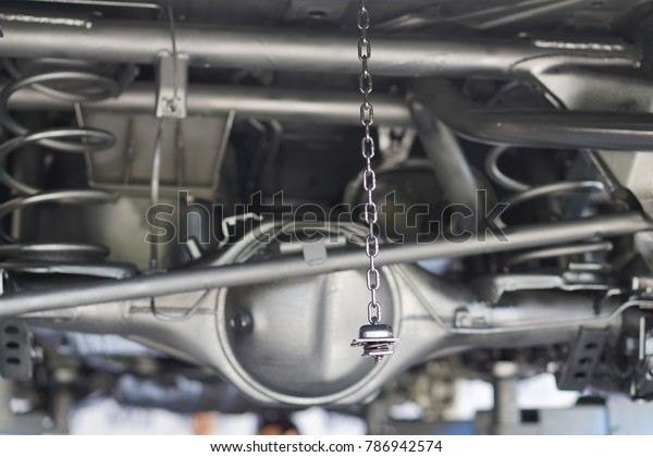 Pickup car axle, Shock absorber and exhaust\
pipe.close up.