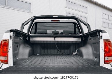 Pickup car with open trunk door ready for loading. Empty trunk boot on pick up car ready for trip