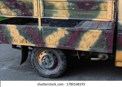 The Pickup Truck Body Is Painted In Camouflage.