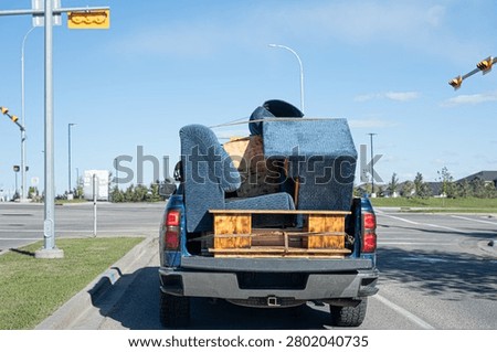Pickup truck with load of Sofas during house move