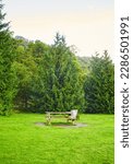 Picnic area with picnic table on a green meadow