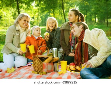 Picnic In Autumn Park.Happy Big Family Outdoor