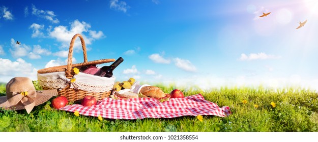 Picnic - Basket With Bread And Wine On Meadow
