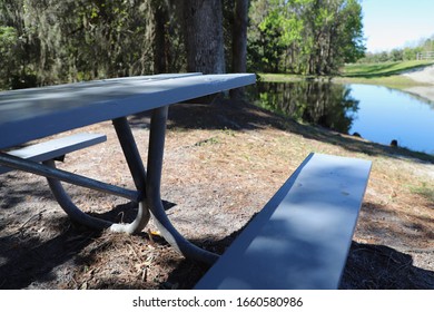 Picnic Bench By Side Of Lake