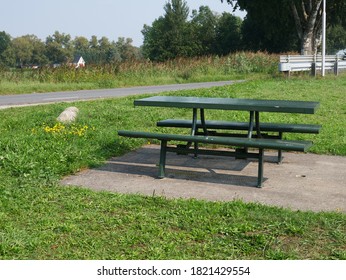 Picnic Bench On The Side Of A Road.