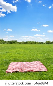 Picnic Cloth On Meadow With Copy Space