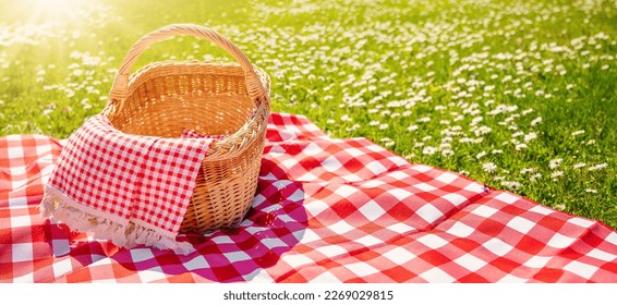 Picnic duvet with empty bascket on the meadow in nature. - Powered by Shutterstock