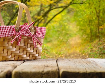 Picnic In Nature. There Is A Picnic Basket On A Wooden Table. Beautiful Autumn Nature. Country Style. Leisure, Relaxation, Picnic, Romance, Outdoor Thanksgiving Celebration.