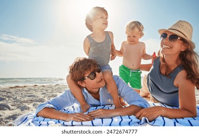 Picnic, piggyback or children with family at beach on holiday vacation or weekend together with parents. Father, mother or happy kids siblings at sea for bonding or playing by ocean in Spain to relax - Powered by Shutterstock