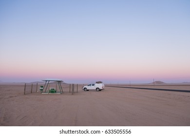 Picnic Rest Area With Benches, Table And Garbage Can In The Middle Of Nowhere Along The B4 Road From Aus To Luderitz In The Namib Naukluft Desert, Namibia, Africa. 