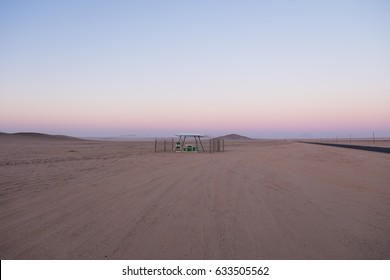 Picnic Rest Area With Benches, Table And Garbage Can In The Middle Of Nowhere Along The B4 Road From Aus To Luderitz In The Namib Naukluft Desert, Namibia, Africa. 