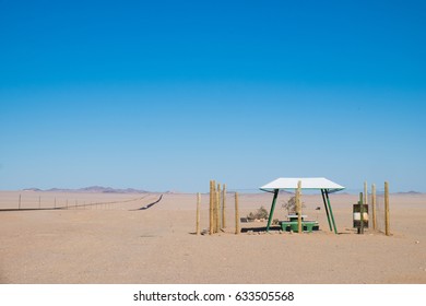 Picnic Rest Area With Benches, Table And Garbage Can In The Middle Of Nowhere Along The B4 Road From Aus To Luderitz In The Namib Naukluft Desert, Namibia, Africa. 