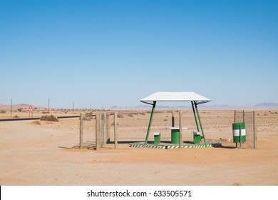 Picnic Rest Area With Benches, Table And Garbage Can In The Middle Of Nowhere Along The B4 Road From Aus To Luderitz In The Namib Naukluft Desert, Namibia, Africa. 