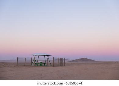 Picnic Rest Area With Benches, Table And Garbage Can In The Middle Of Nowhere Along The B4 Road From Aus To Luderitz In The Namib Naukluft Desert, Namibia, Africa. 