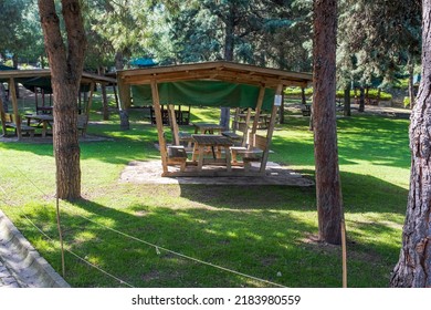 Picnic Shelter Or Covered Picnic Table In Public Park.  Wooden Eating Bench.