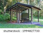 A picnic shelter in a national park bushland setting for tourists to rest and relax
