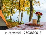 Picnic table by the lake at a campground in autumn