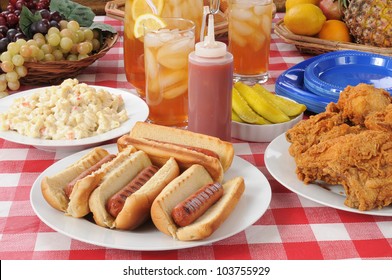 A Picnic Table Loaded With Summer Foods