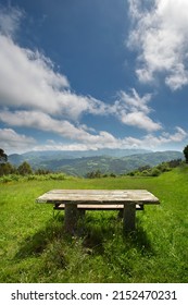 A Picnic Table With Mountain View. No People. Sunny Day. Quiet And Relaxing Concept. Public Recreation Area. Copy Space.