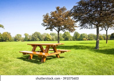 Picnic table on a green meadow