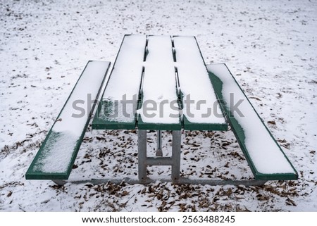 Picnic table in the snow.