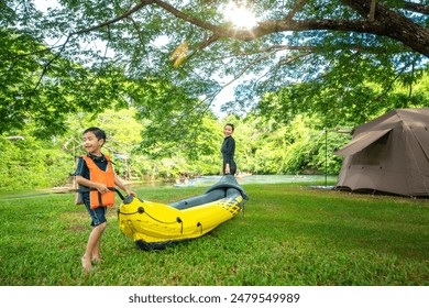 Picnic travel of Asian families In the forest of the national park There are tent camping, kayaking, and white water rafting activities together. Thailand - Powered by Shutterstock