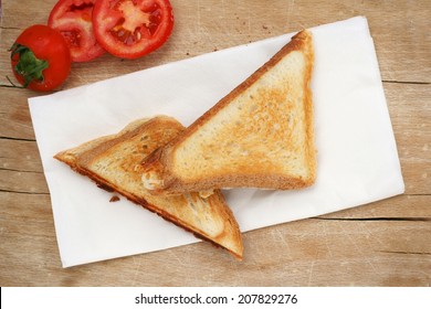 Picnic with triangle sandwich toast and fresh tomato