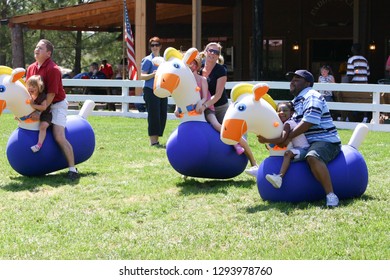 Picnickers Begin Their Bouncy Horse Race. Taken At Canale Farms In Memphis TN On September 10, 2006.