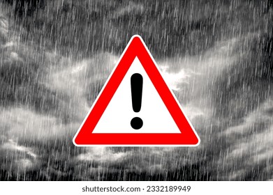 Pictogram of warning triangle with exclamation mark against dramatic under weather sky as symbol for severe weather warning - Shutterstock ID 2332189949