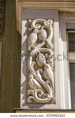 Pictorial decorations on the facade of a historic residential and commercial building in the reform style of the 1910s in the historic Old Town of Pirna, Saxon Switzerland, Saxony, Germany.