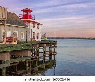 Pictou, NS - June 1 2018: Pictou Harbour Lighthouse, Dock And Museum At Sunset.