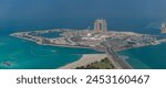 A picture of the Abu Dhabi Breakwater, with the Marina Mall and the Rixos Marina Abu Dhabi Hotel in the center.