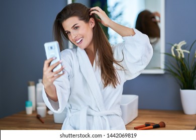 Picture of adult brunette woman in the bathroom - Powered by Shutterstock