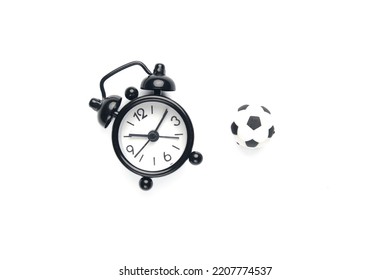 A Picture Of Alarm Clock And Miniature Ball. Football Time Concept.