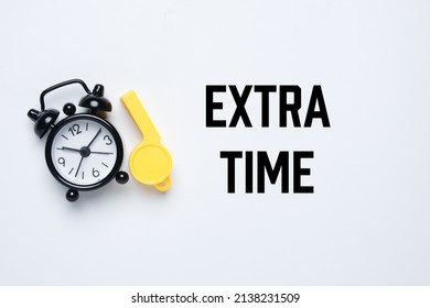 A picture of alarm clock and whistle with the word extra time. Extra time concept. - Shutterstock ID 2138231509