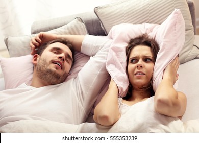 Picture Of Angry Woman In Bed With Snoring Man