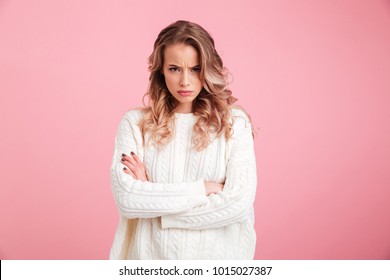 Picture of angry young woman standing isolated over pink background. Looking camera. - Shutterstock ID 1015027387