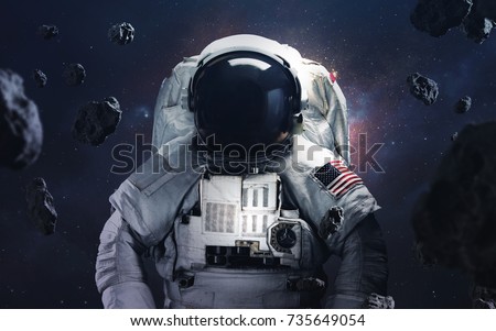 Picture of astronaut spacewalking at the awesome cosmic background. Deep space image, science fiction fantasy in high resolution ideal for wallpaper and print. Elements of this image furnished by NASA