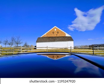 Picture Of A Barn At Gettysburg National Park With A Cannon Ball Hole In It. Photo Shot Off The Roof Of A Car.