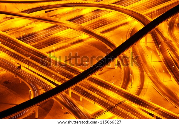 Picture of beautiful road at night, aerial\
view on highway in Dubai downtown, united arab emirates, conceptual\
of luxury tourism, illuminated expressway road in evening, new way\
architecture