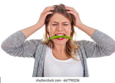 Picture Of A Beautiful Woman With A Chili Paprika In Her Mouth, Too Spicy Vegetable