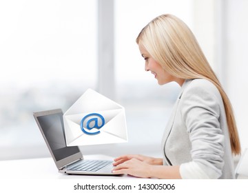 Picture Of Beautiful Woman With Laptop Computer Sending Email