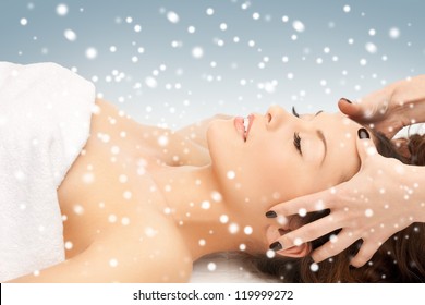 picture of beautiful woman in massage salon with snow