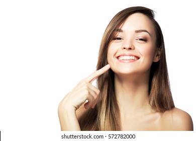 Picture Of Beautiful Woman Pointing To Teeth