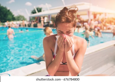 Picture From A Beautiful Women In Bikini With Handkerchief. Sick Female Model Has Runny Nose. Girl Makes A Cure For The Common Cold. She Is Sick In The Summer On Vacation