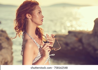 Picture of a beautiful young woman with swimsuit in vacation in Croatia, dalmatian coast, 